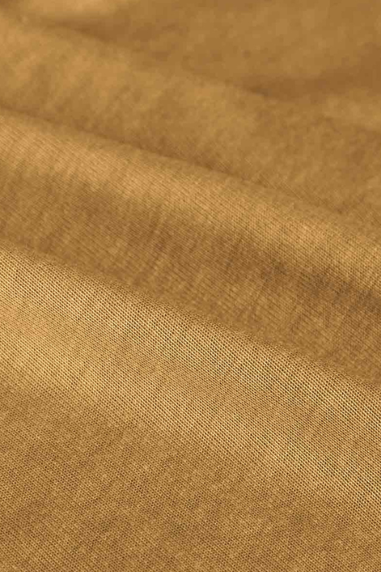 Close-up of brown fabric with visible texture