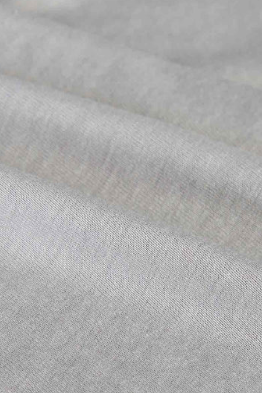Close-up of gray fabric with a subtle pattern