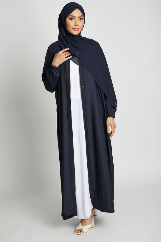 Elegant deep navy kimono abaya with open front design and white slip dress, modest abaya with cuff detailing for women