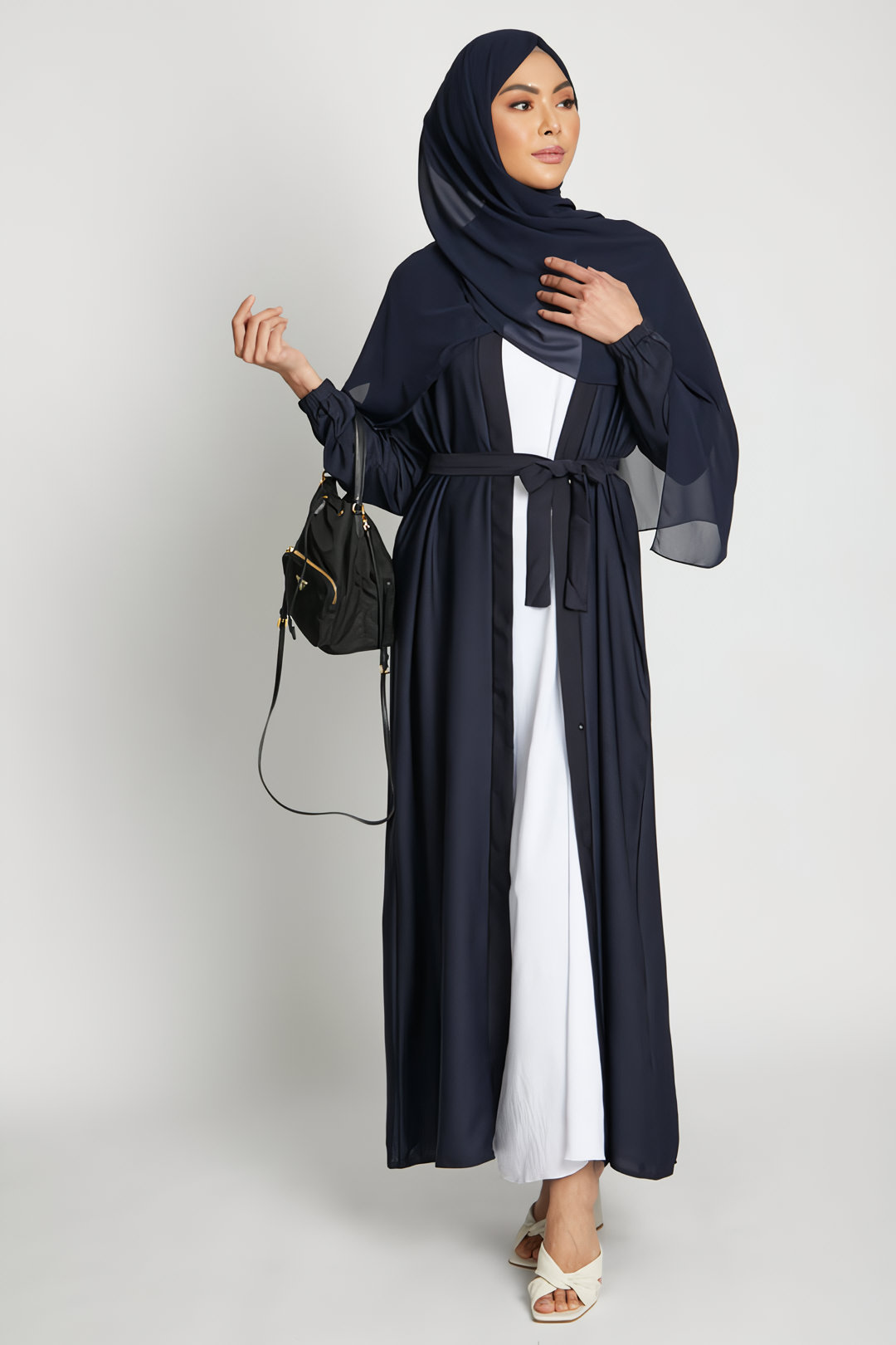 Full front view of deep navy open kimono abaya with white inner slip dress and elasticated cuffs, elegant modest abaya for women