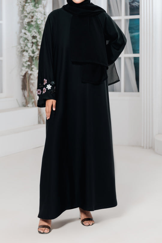 Back view of elegant women abaya featuring hand-work sleeves in premium imported Nida fabric, modest fashion Pakistan