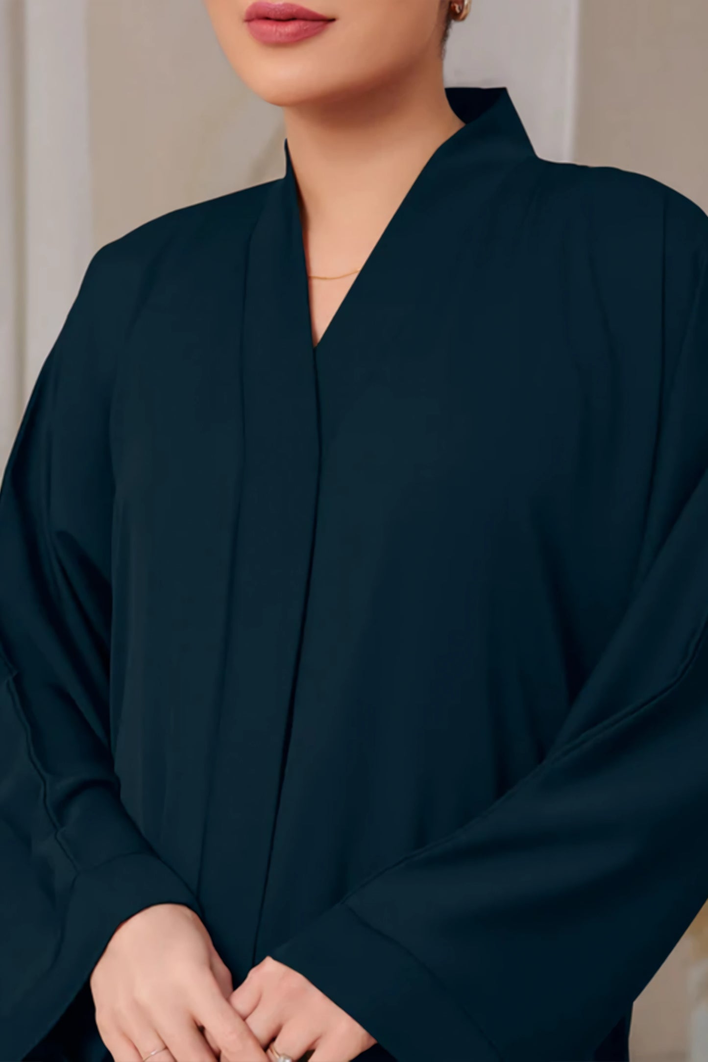 Zoomed-in view showing fine crepe texture and neat front open stitching on Forest Green Abaya – Abaya for Women