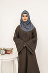 Close-up zoom on front design of butterfly sleeve abaya, elegant detailing for modest women’s