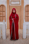 Front view of Arabic style red kaftan abaya showing elegant embroidery and loose fit design