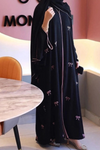 Side angle of Luxe Bow Abaya highlighting modern bow detail and graceful flow for modest women’s wear