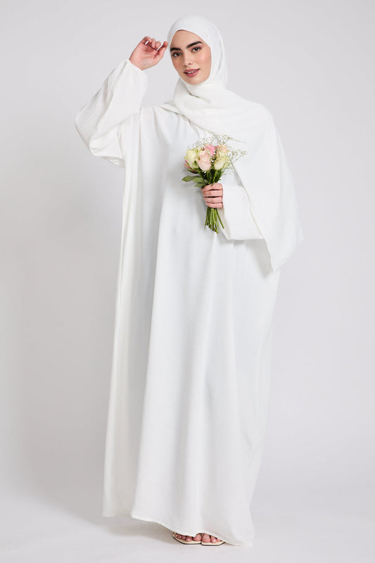 Model wearing White Closed Abaya with Front Zip showing modest fit, premium stitching, and full-length coverage