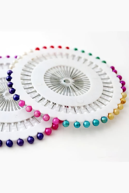 Close-up view of Premium Hijab Pin Wheel featuring 40 multi color hijab pins, durable tempered steel with nickel coating by Abaya for Women.