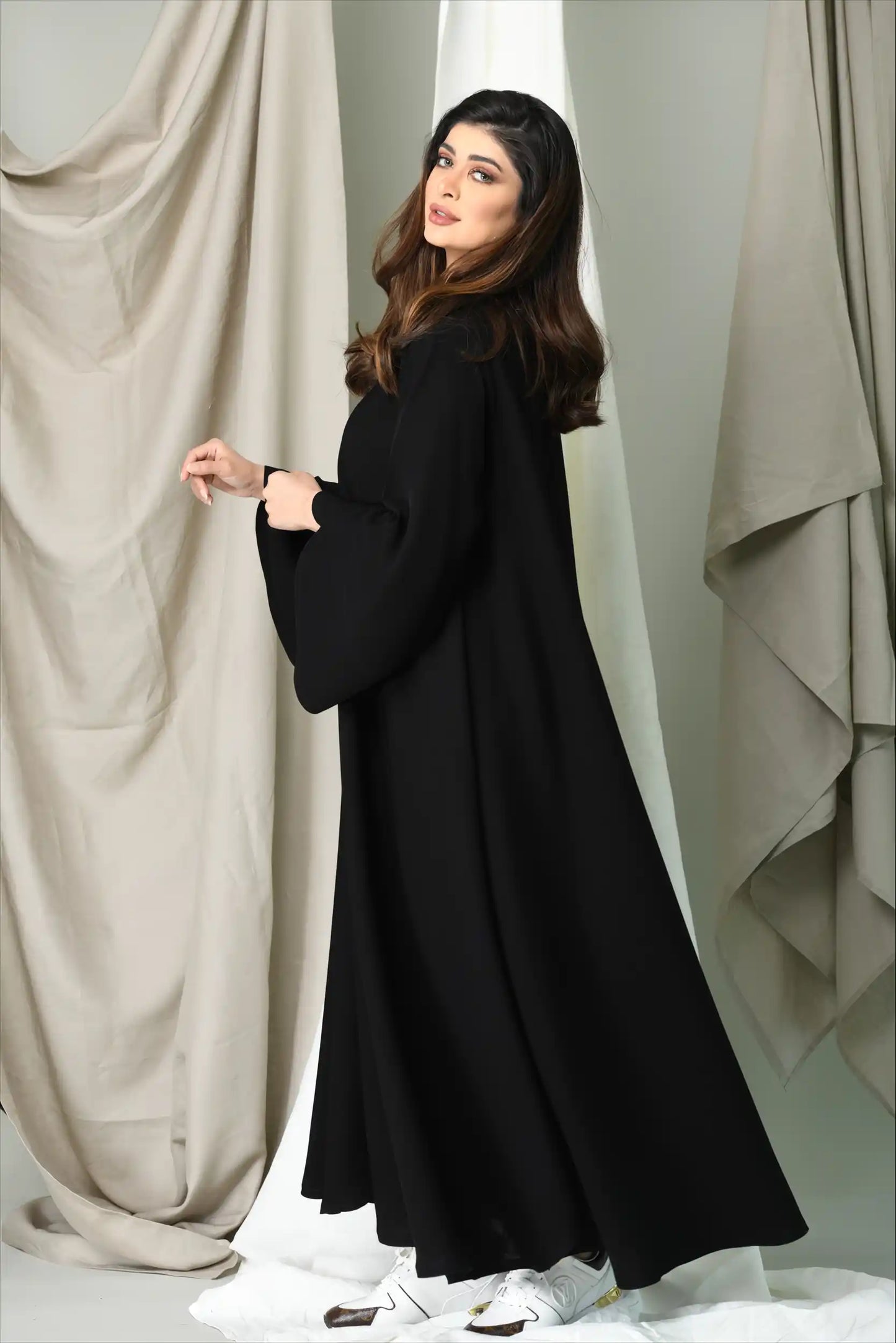 Side angle of Premium Closh Cut Practical Abaya showcasing flare cut, flowing fabric, and modest elegant silhouette.