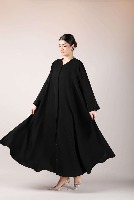 Side angle showcasing the flowy wide bottom gair design of the Front Open Arabic Abaya in premium nida fabric.