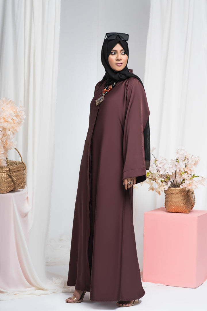 Side full view of maroon jilbab abaya, simple and elegant Islamic dress for women in Pakistan