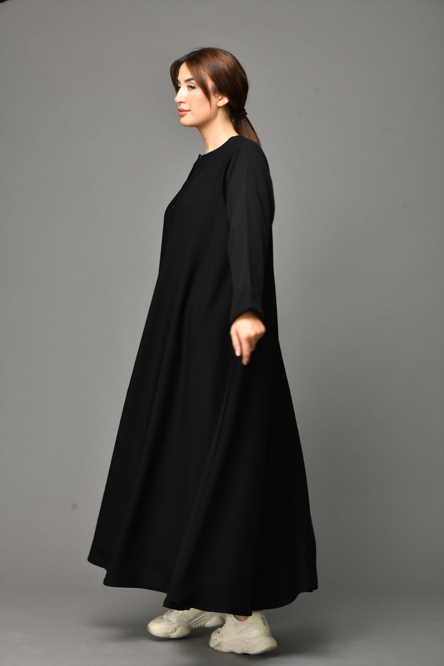 Side angle view of Arabic Style Zipper Abaya showcasing premium nida fabric and modest Arabic cut.