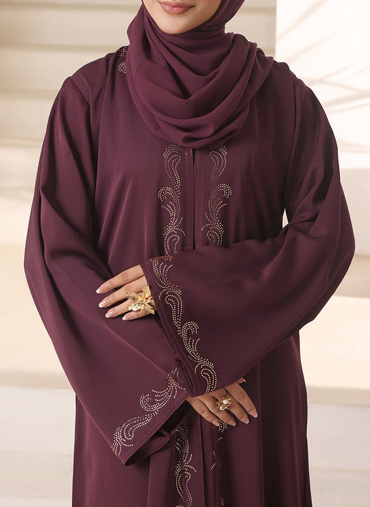 Close-up front zoom of stone embellishment detailing on Nida fabric abaya for women, luxury modest wear