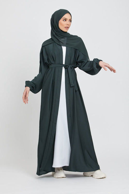 Front full view of stylish green kimono abaya paired with white inner slip dress, modest abaya outfit for women