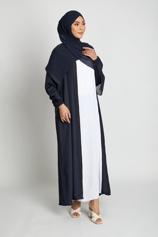 Front view of open navy kimono abaya paired with white inner slip, modest abaya outfit with elasticated cuff sleeves for women