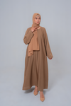 Front view of The Basic Simple Beige Abaya showcasing modest full-length design and elegant beige color for women