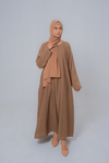 Front view of The Basic Simple Beige Abaya showcasing modest full-length design and elegant beige color for women