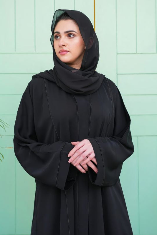 Close-up half view of Black Front Open Plain Abaya highlighting its elegant front design and premium fabric quality.