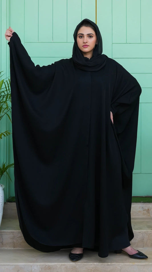 Black Premium Kaftan front view showing its smooth front fall, graceful movement, and luxurious fabric finish.