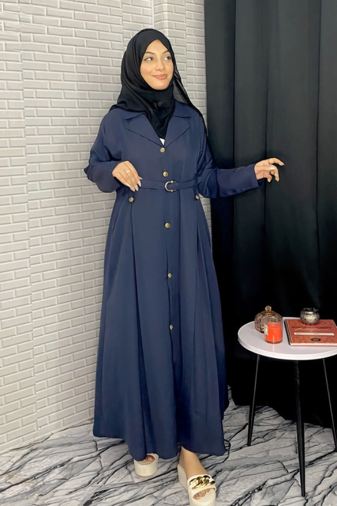 Side view of Turkish-style navy abaya highlighting graceful drape, soft flowy fabric, and modest silhouette inspired by Turkish fashion.