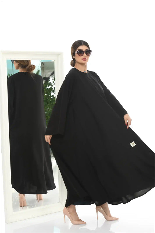 Side angle of Arabic Style Plain Abaya highlighting flowy silhouette and elegant modest design.