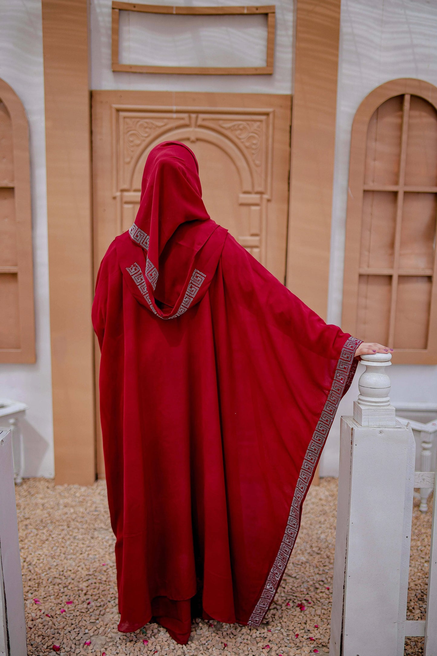 Back view of Arabic style kaftan abaya in rich red fabric with graceful fall