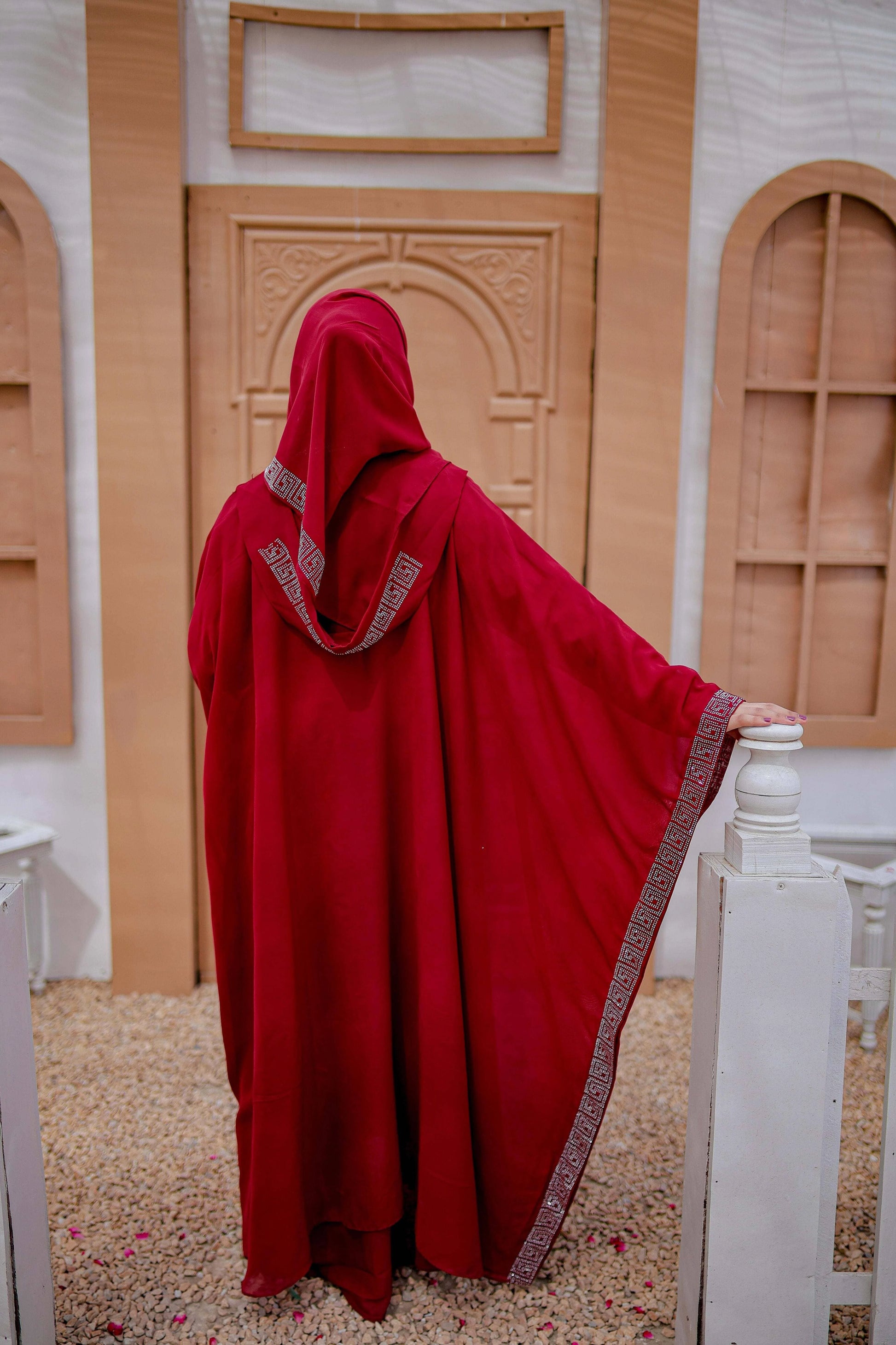 Back view of Arabic style kaftan abaya in rich red fabric with graceful fall