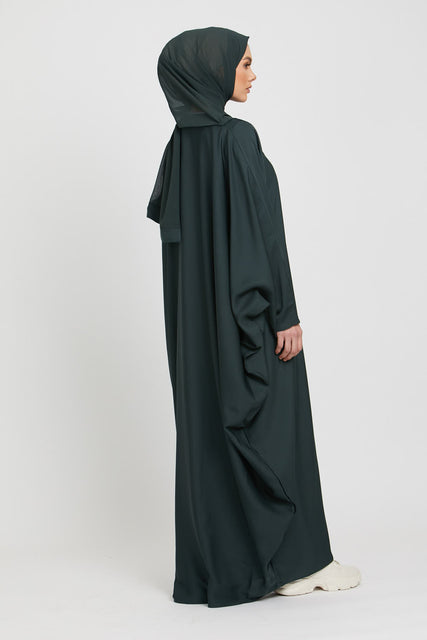 Back side full view of dark green kaftan abaya in loose fit size, elegant modest abaya fashion for women