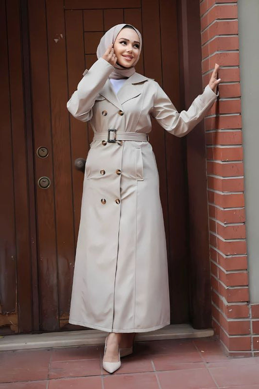 Women’s beige Turkish trench coat side view showcasing modest fit