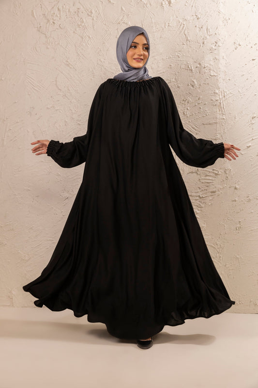 Stylish black abaya featuring pearl embellishment on neckline, full front view, modest abaya for women in Pakistan