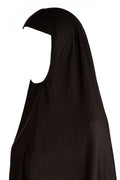 Black niqab on a white background