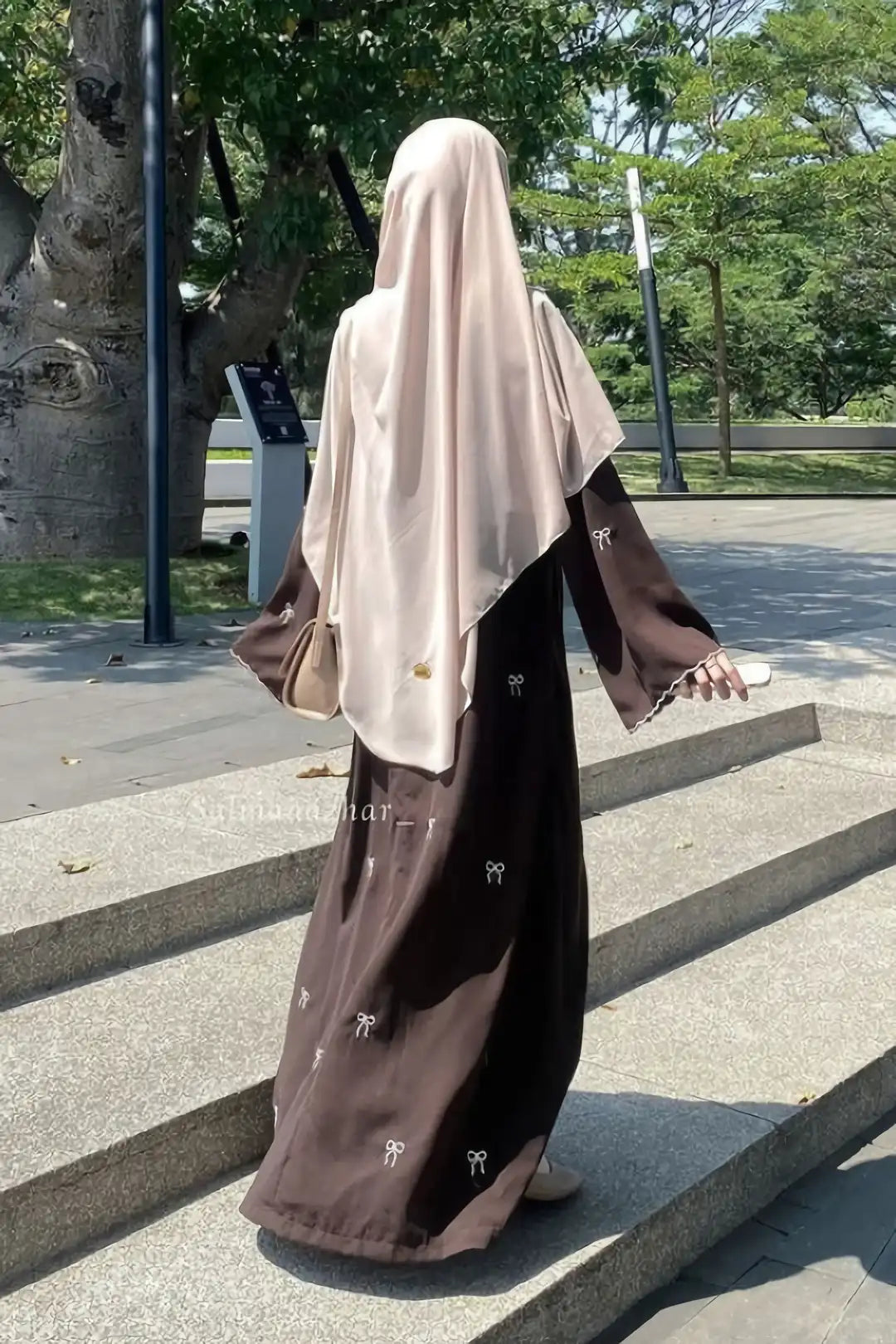 Back view of Bow Embroidered Zoom Nida Abaya showcasing the smooth drape, modest fit, and elegant flow of the premium fabric.