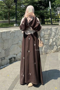 Elegant Bow Embroidered Zoom Nida Abaya in black shown from the front, featuring a modest silhouette and delicate bow embroidery.