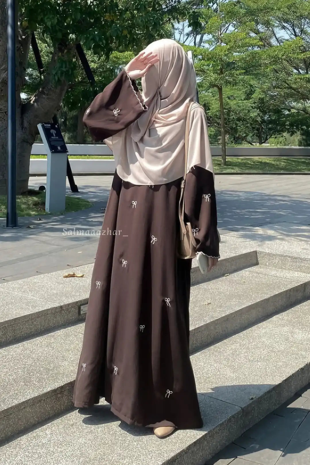 Stylish side pose of Bow Embroidered Zoom Nida Abaya highlighting the flowing Zoom Nida fabric and refined embroidery details.