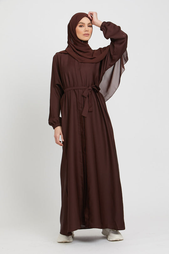 Elegant front view of brown kimono abaya layered with white inner slip dress, modest wear abaya with elasticated cuffs for women