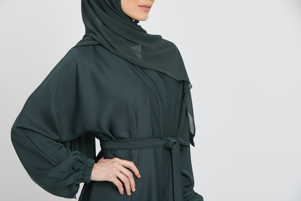 Close-up zoom on chest design of green kimono abaya layered with white slip dress, stylish modest wear abaya for women