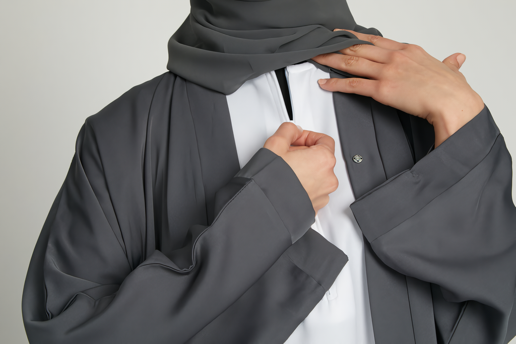 Zoom-in view of chest design and layering of grey kimono abaya with white slip dress, modern modest fashion for women
