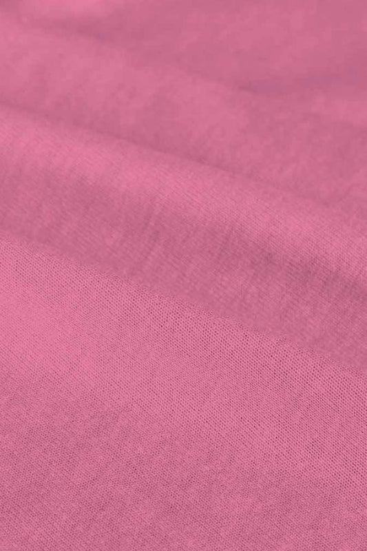 Close-up of pink fabric with a subtle texture