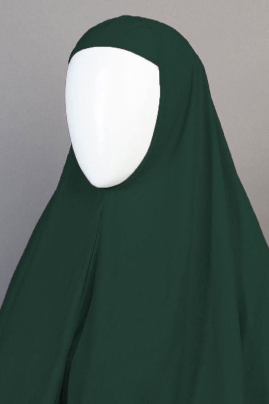 Dark green hijab on a mannequin against a gray background