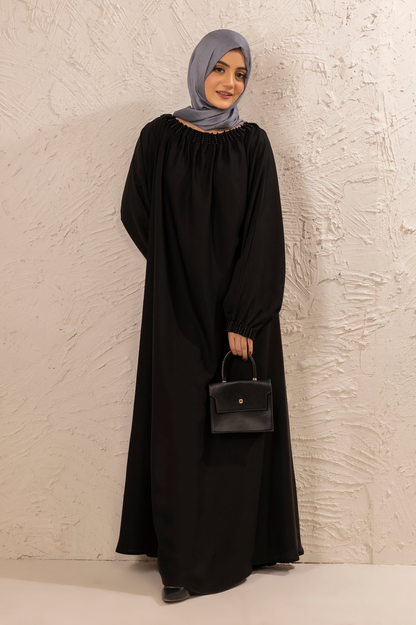 Full front view of black abaya with pearls on neckline, elegant modest abaya for women, online abaya shopping Pakistan