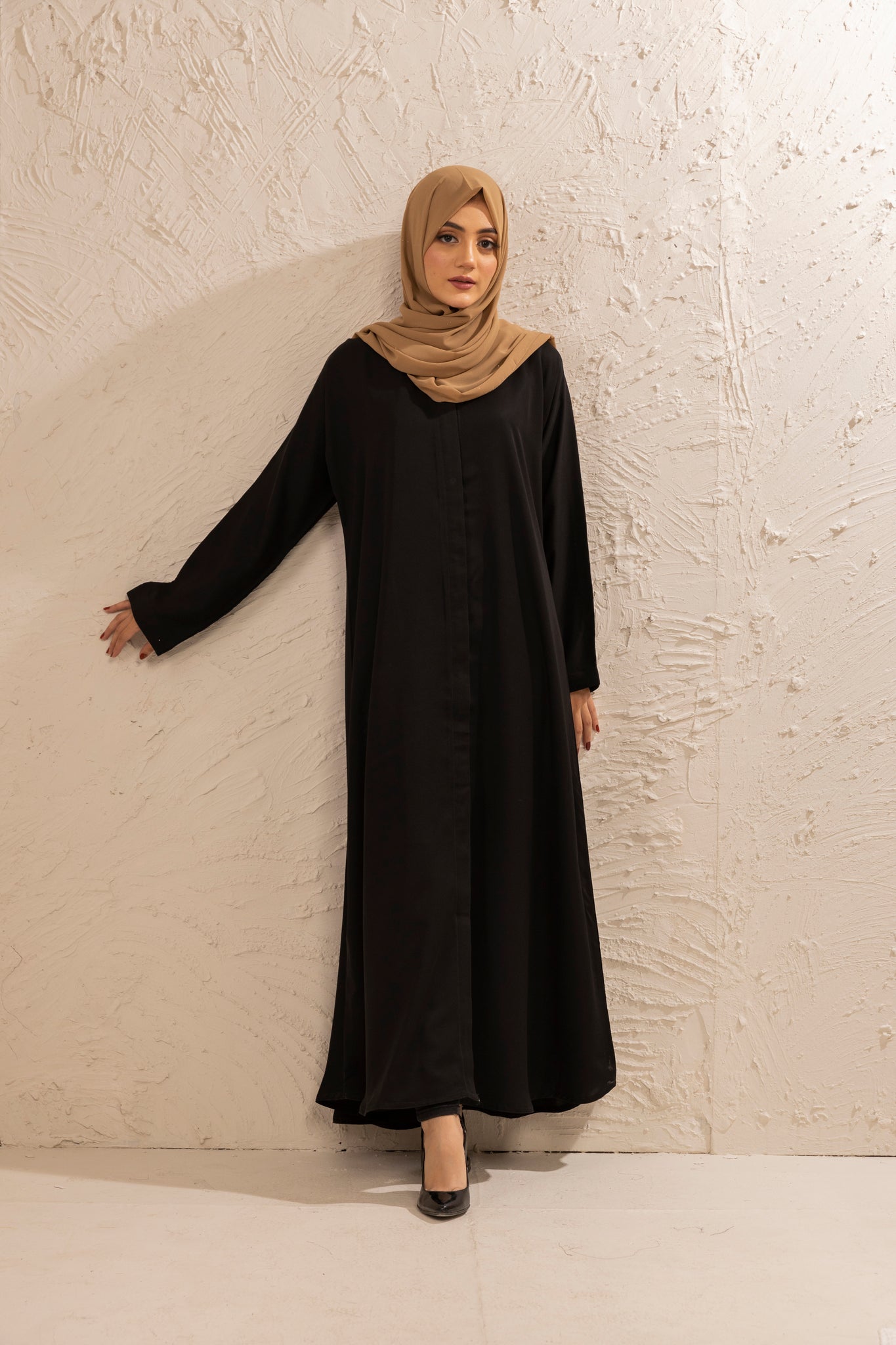 Simple black abaya in open style, front view showcasing elegant modest outfit for women in Pakistan