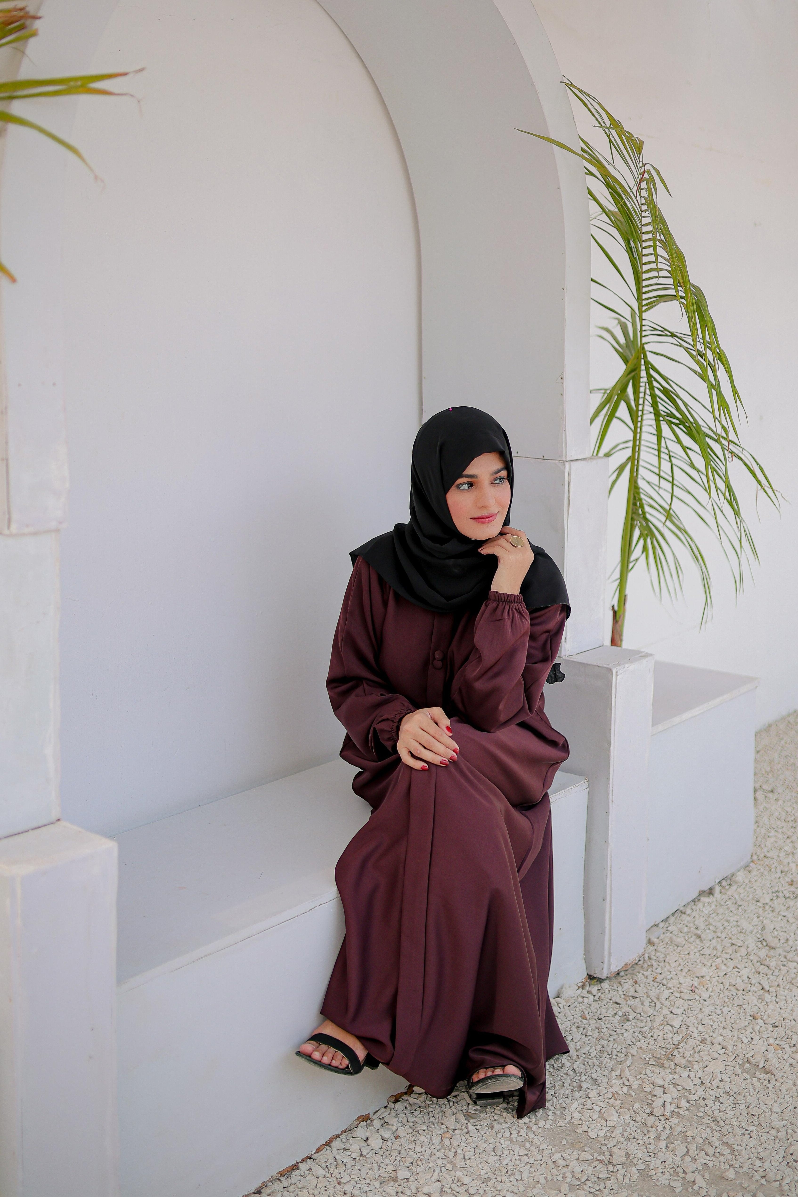Close-up of front button design on multi color abaya, elegant abaya for women, perfect modest wear style Pakistan