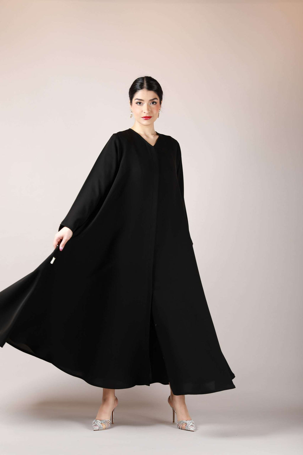 Front view of flowy Arabic abaya with wide bottom gair, crafted from premium nida fabric for elegance and comfort.