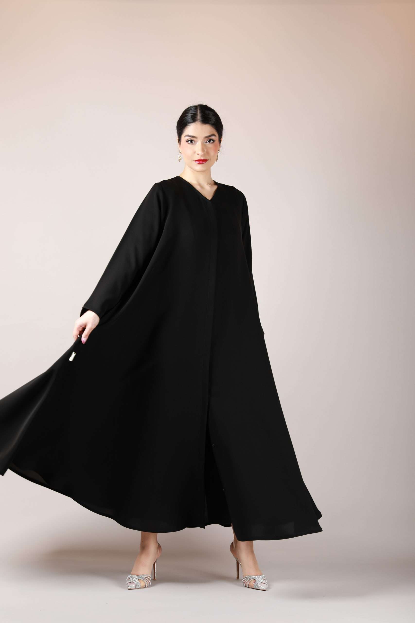 Front view of flowy Arabic abaya with wide bottom gair, crafted from premium nida fabric for elegance and comfort.