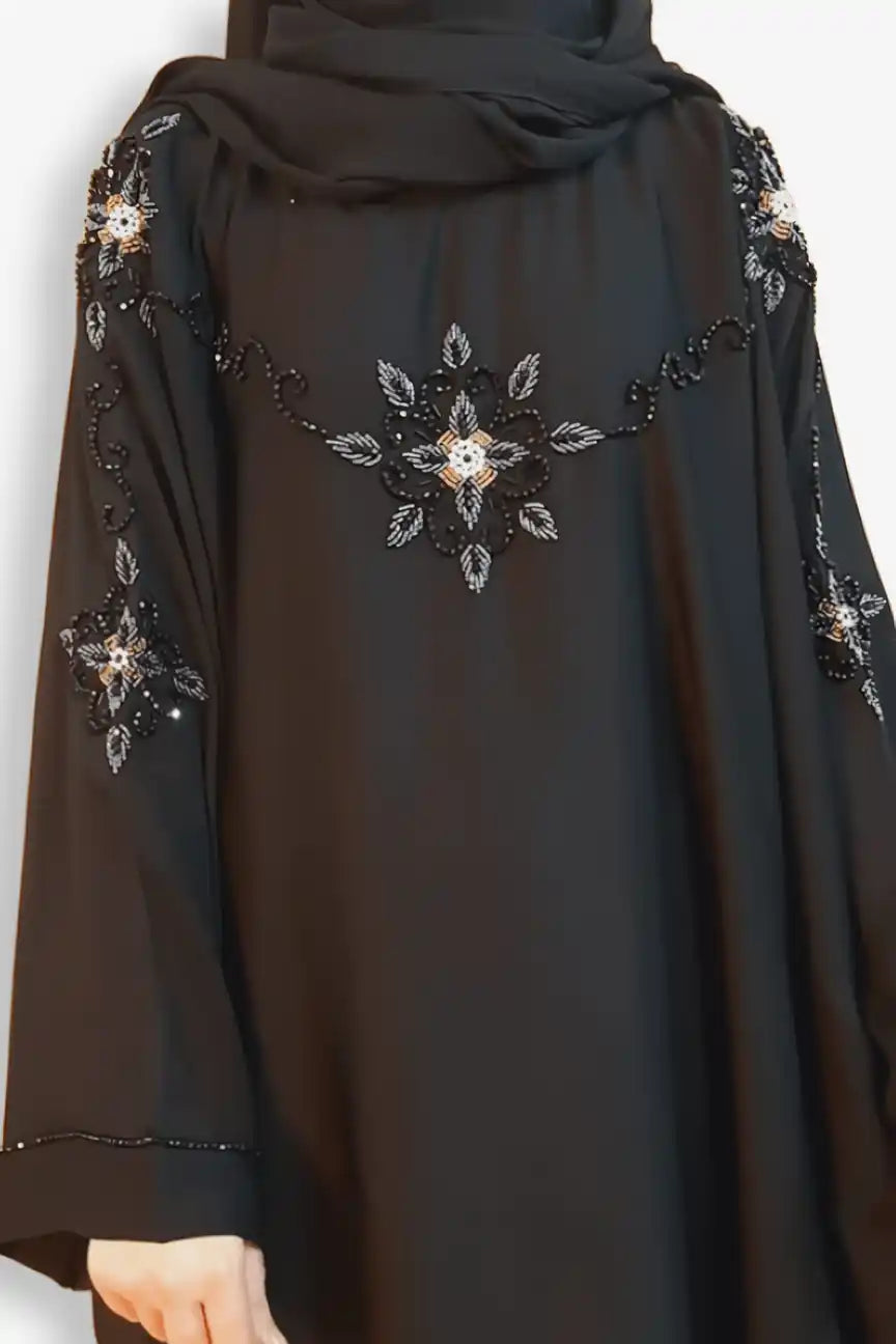 Detailed close-up of hand work embellishment on baggy style abaya, stylish modest abaya for women, online abaya shopping Pakistan