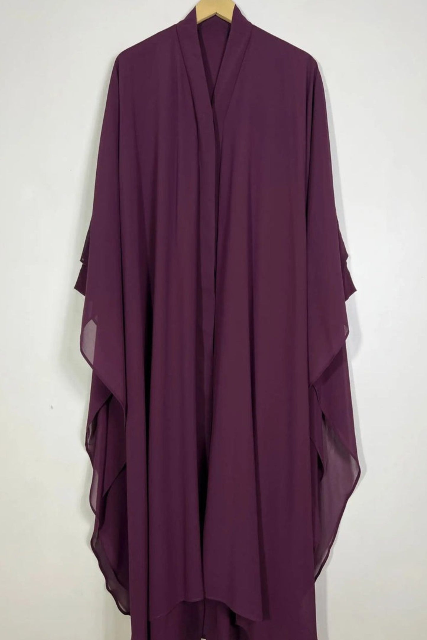 Halimah maroon front open butterfly abaya hanging on hanger showing double layer chiffon fabric and soft fall