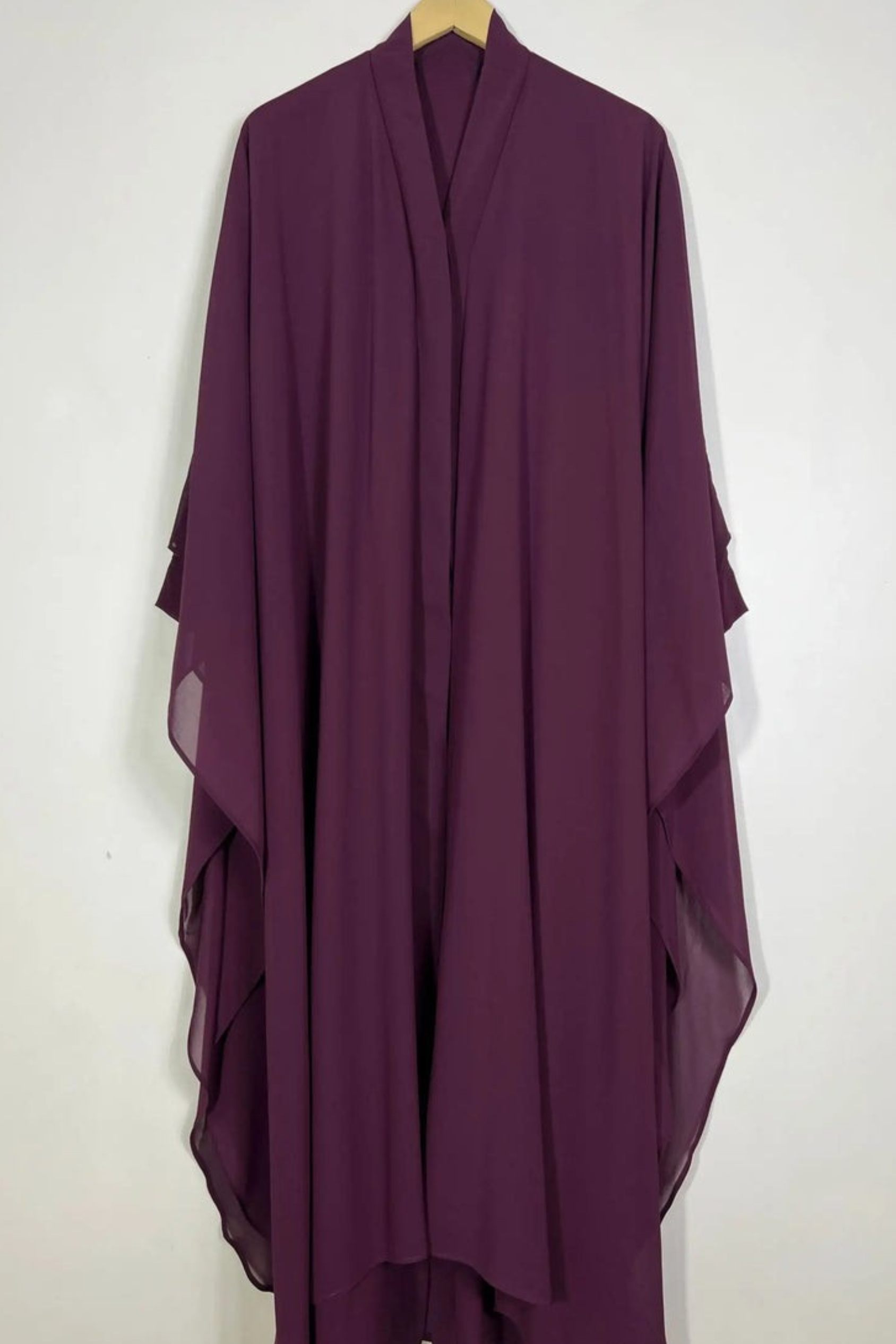 Halimah maroon front open butterfly abaya hanging on hanger showing double layer chiffon fabric and soft fall