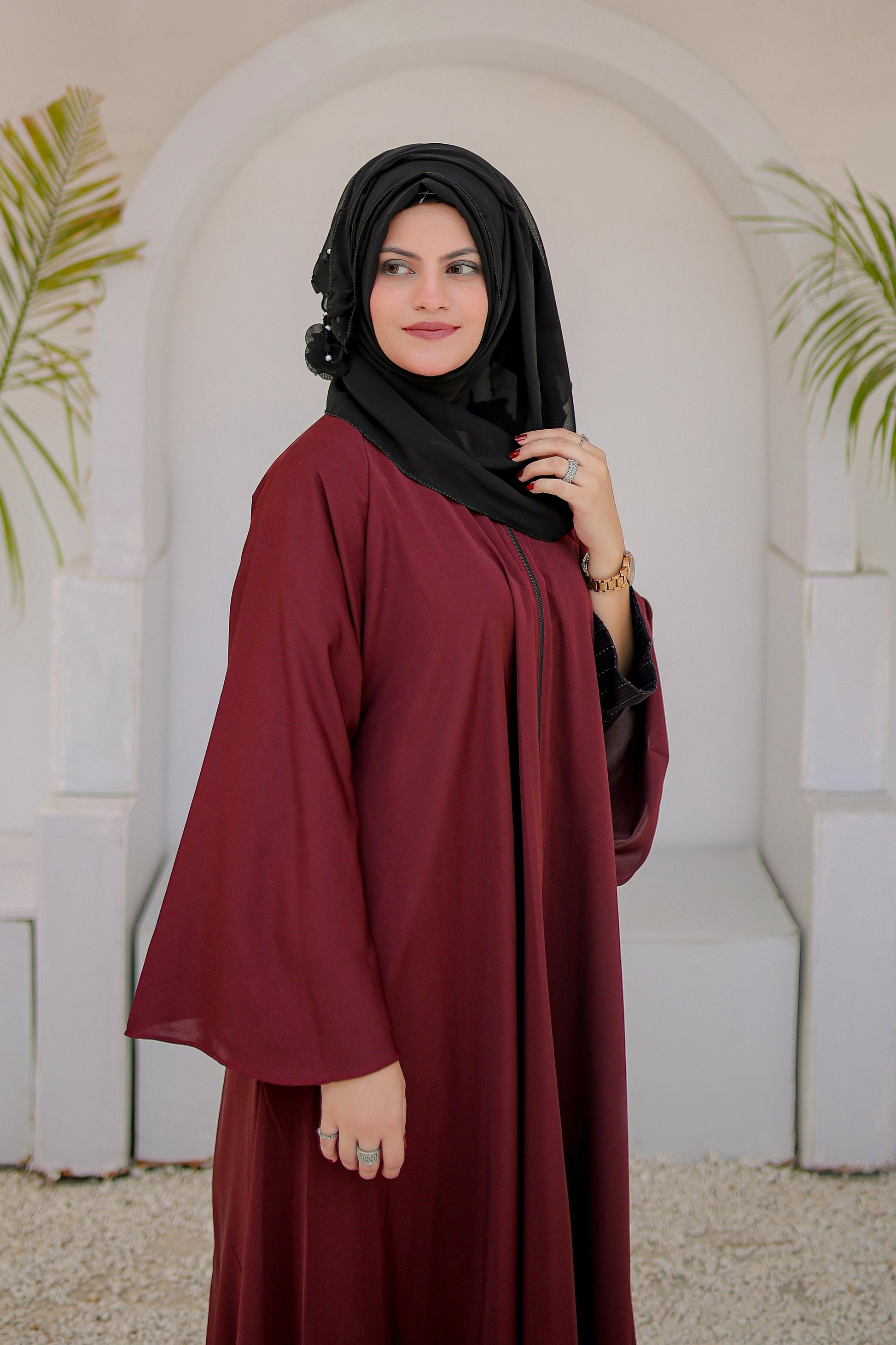 Side angle of Maroon Front Open Zipper Abaya highlighting flowy silhouette, zipper detail, and graceful modest fashion style