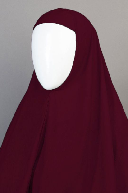 Maroon hijab on a mannequin against a gray background