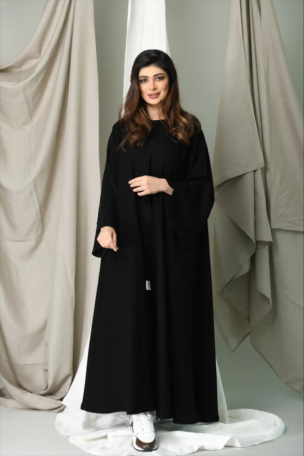 Front angle of Premium Closh Cut Abaya showing flowing silhouette and practical front close design.