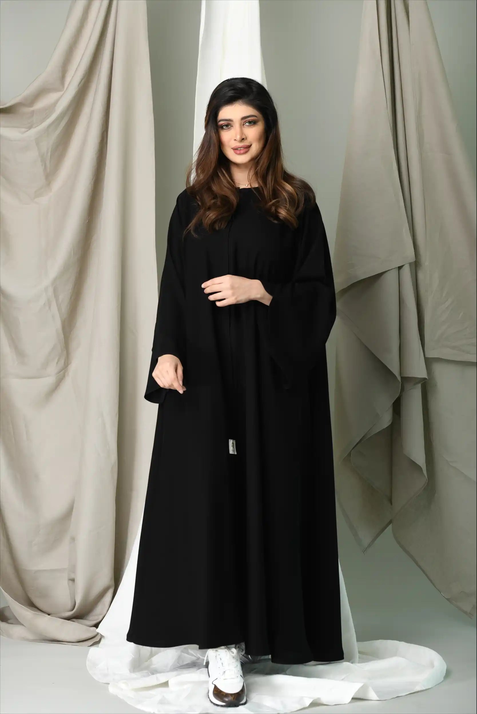 Front angle of Premium Closh Cut Abaya showing flowing silhouette and practical front close design.